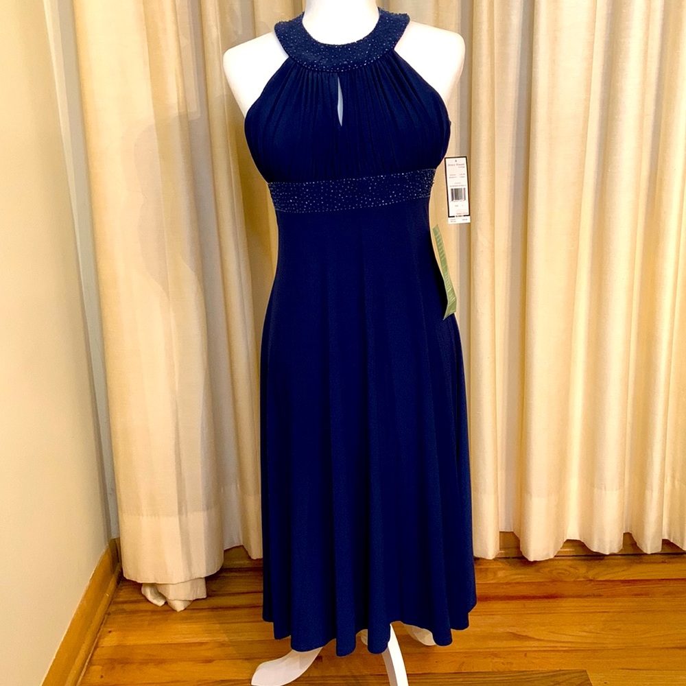 Navy blue special occasion dress with beaded halter neckline.